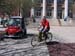 student on yellow bike by Gem Car